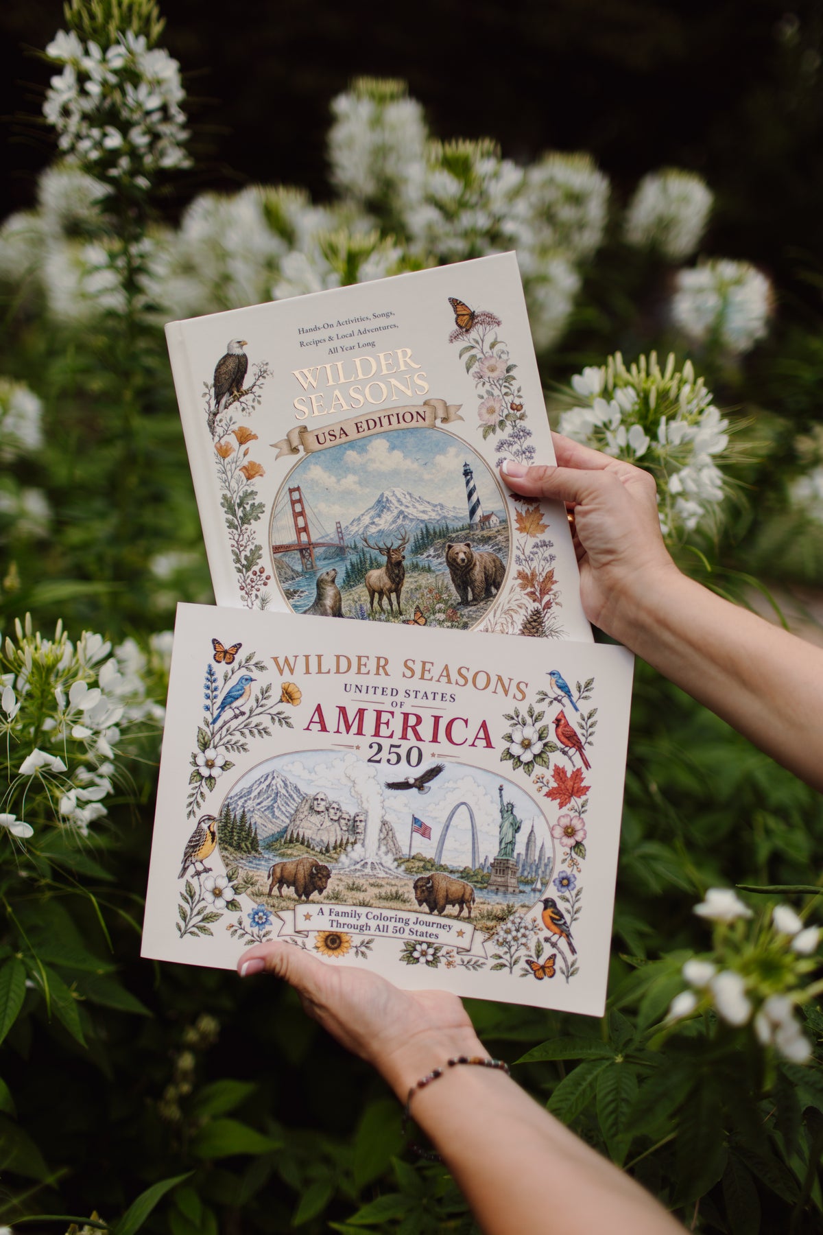 Wilder Seasons USA Family Edition and America 250 coloring book displayed outdoors